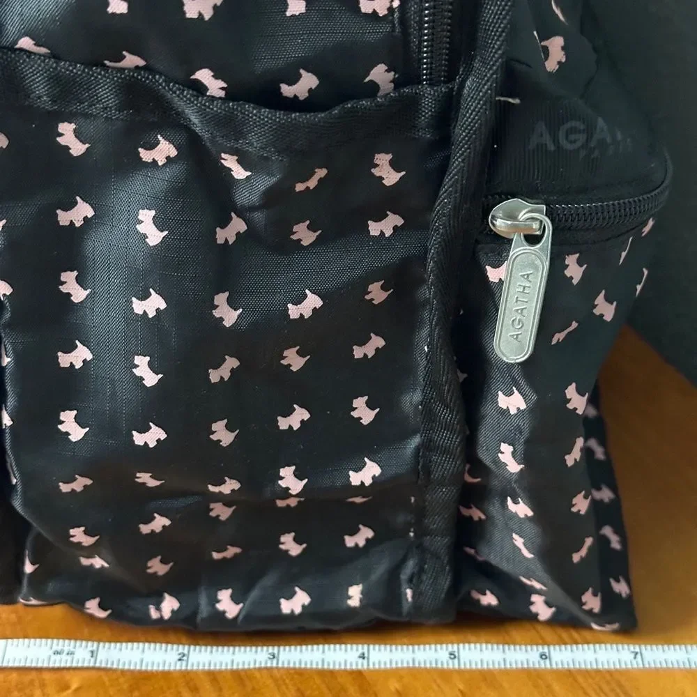 Agatha Paris Black Backpack With Pink Scottie Dog Pattern all over.